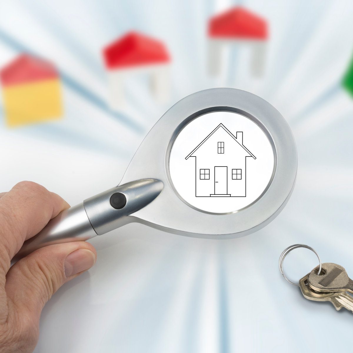 Magnifying glass in the hand on a white